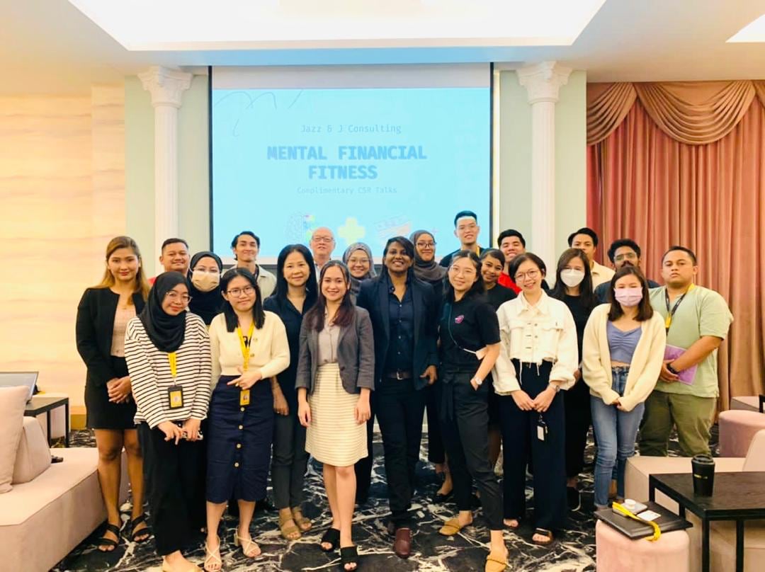 Jazz James with a workshop group after a financial fitness session.